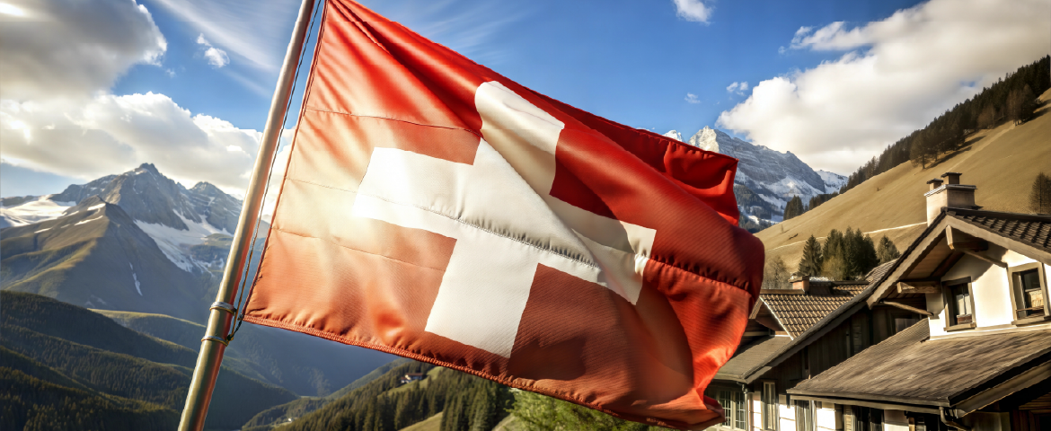 Paisagem natural da Suíça, com bandeira do país em primeiro plano.